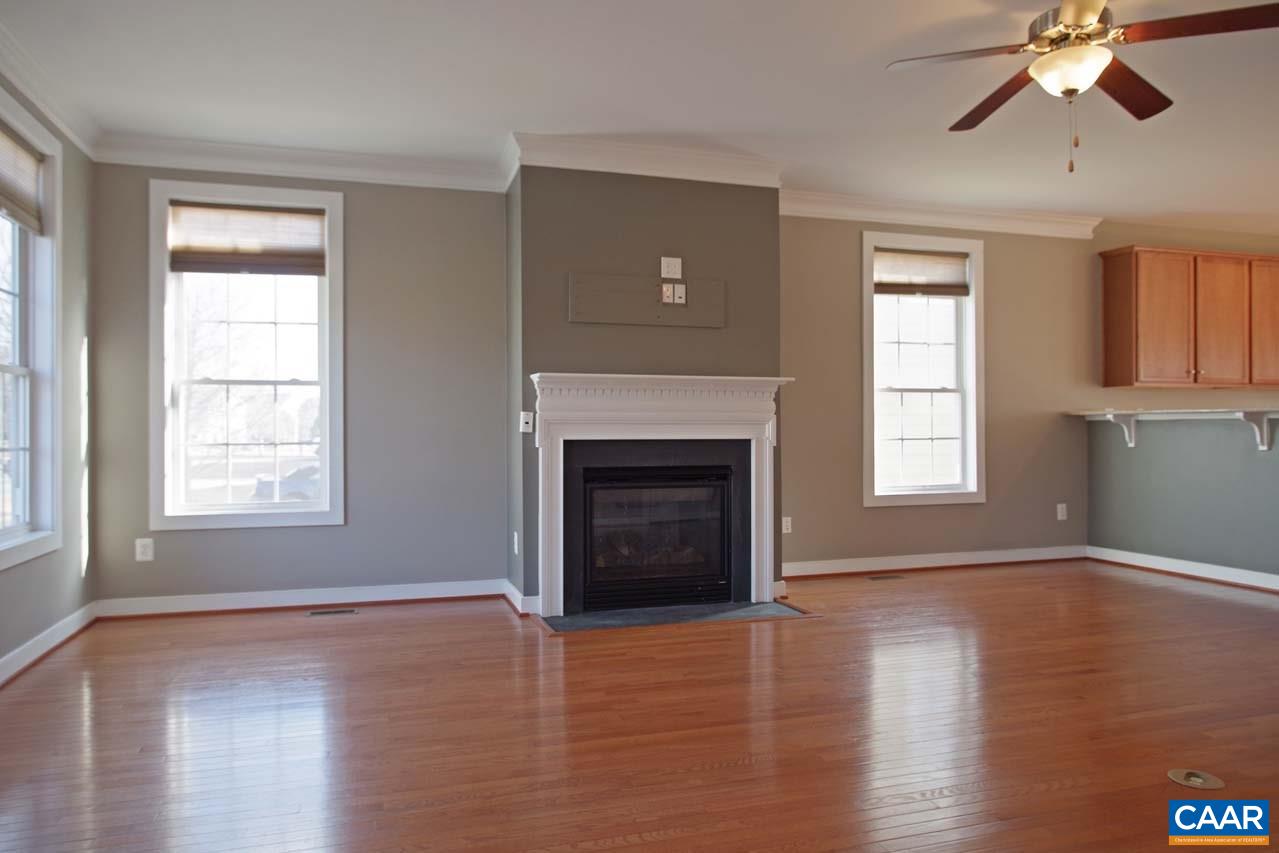 5477 Park Road Crozet, VA 22932 - Photo 4 of 47 a view of an empty room with wooden floor fireplace and a window