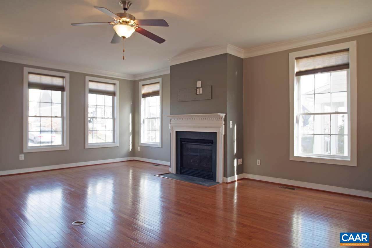 5477 Park Road Crozet, VA 22932 - Photo 5 of 47 a view of an empty room with wooden floor and a window