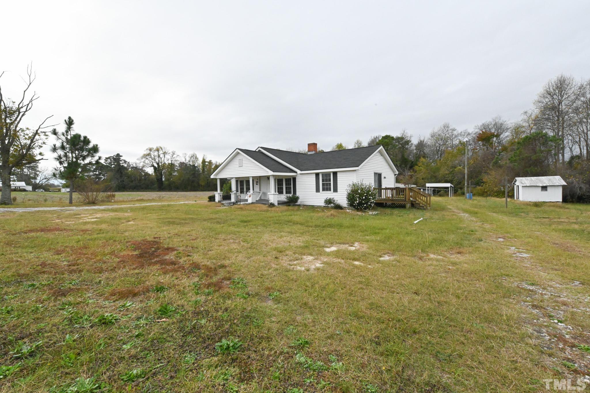 4765 Baileys Crossroads Road Coats, NC 27521 - Photo 2 of 43 a view of house with an outdoor space and seating