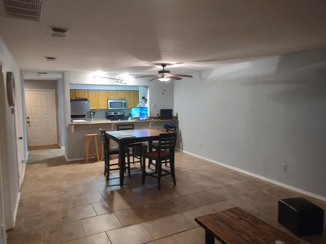 a view of a dining room with furniture