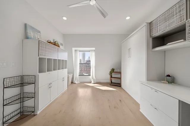 a kitchen with stainless steel appliances a refrigerator sink and microwave