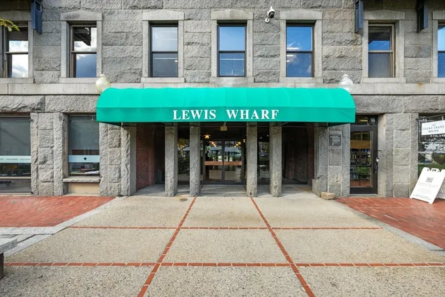 a view of a garden with a building in the background