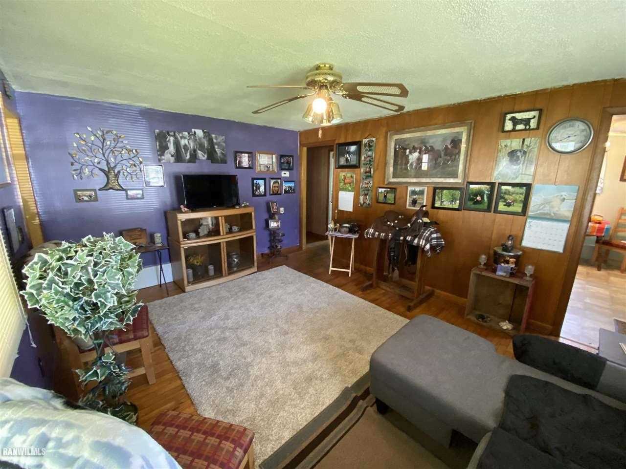 501 Ridge Street Mount Carroll, IL 61053 - Photo 2 of 3 a living room with furniture and a flat screen tv