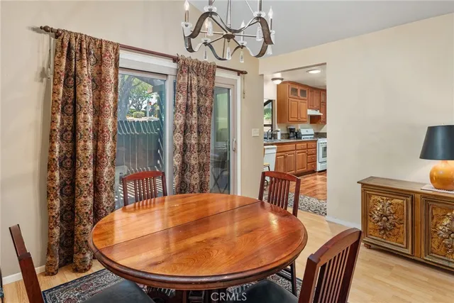 a large kitchen with a table and chairs