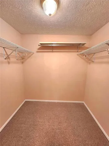 a bathroom with a toilet sink and shower