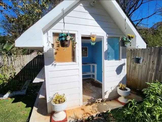 a swimming pool with outdoor seating