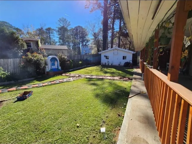a view of a swimming pool and an outdoor space