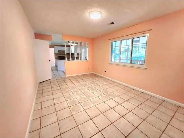 a view of an empty room and window