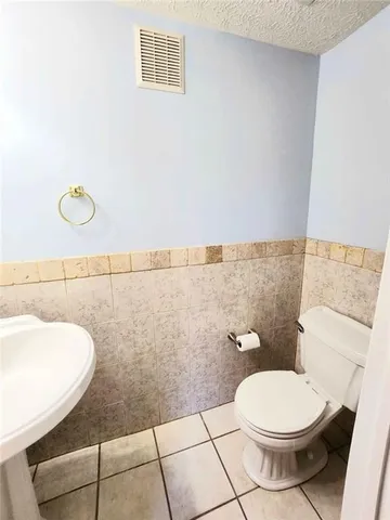 a bathroom with a toilet and a sink
