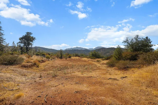 a view of mountain view with lots of trees