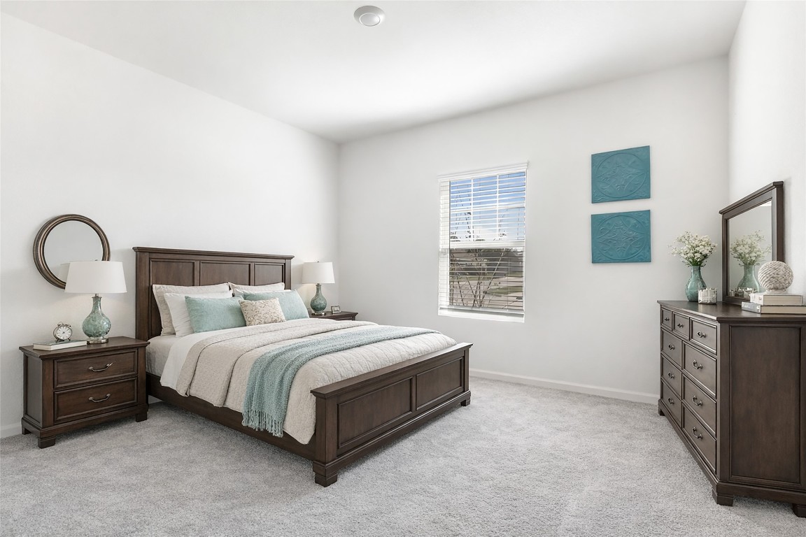 28319 Peppard Lane Huffman, TX 77336 - Photo 13 of 30 a bedroom with a bed and a flat screen tv
