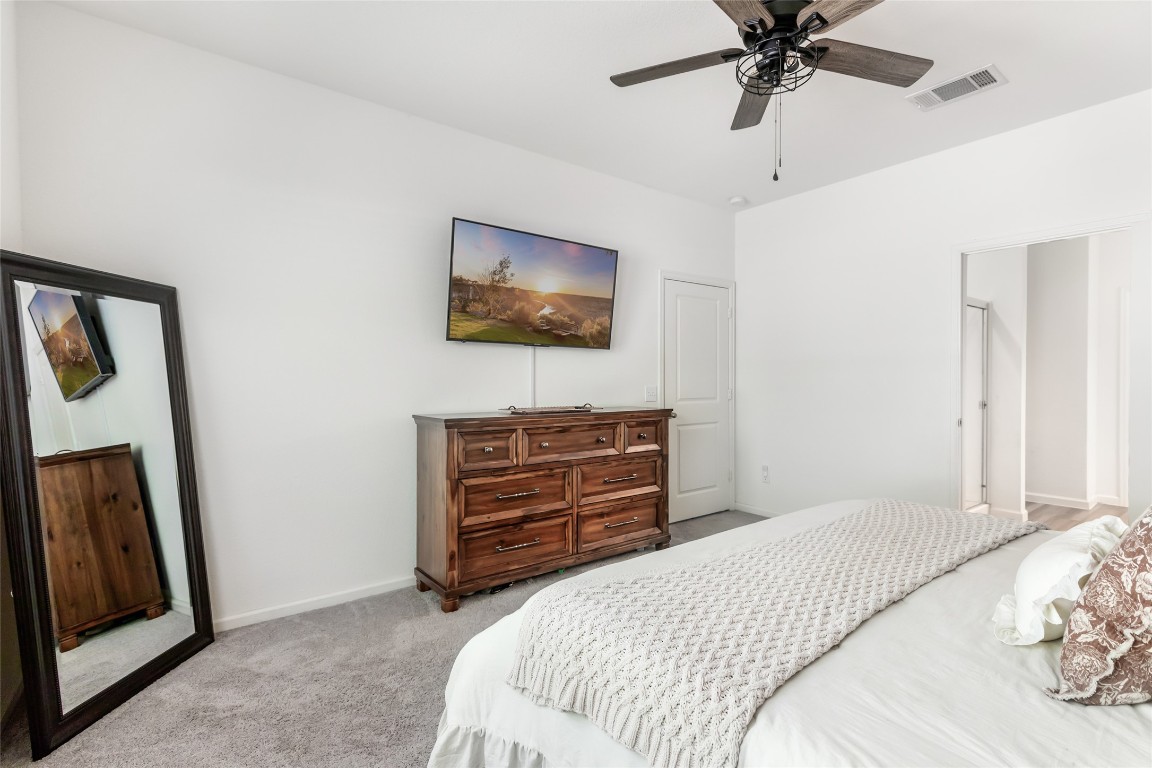 28319 Peppard Lane Huffman, TX 77336 - Photo 19 of 30 a bedroom with a bed and a flat screen tv