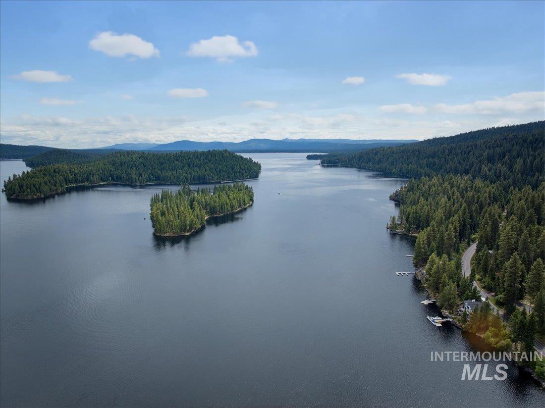 3800 Warren Wagon Road McCall, ID 83638 - Photo 45 of 50 Expansive waterfront landscape featuring a large body of water, densely forested shorelines, multiple islands, and distant mountains under a blue sky