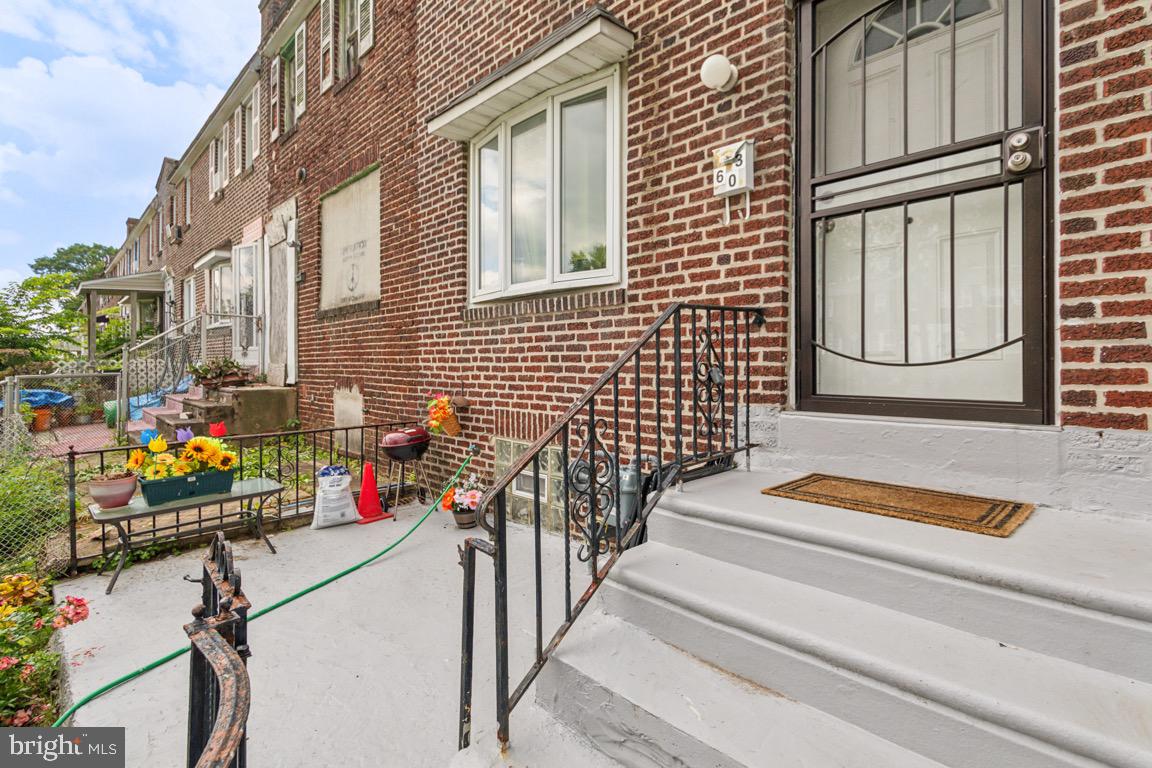 603 Raritan Street Camden, NJ 08105 - Photo 3 of 9 a view of path along with building and flowers