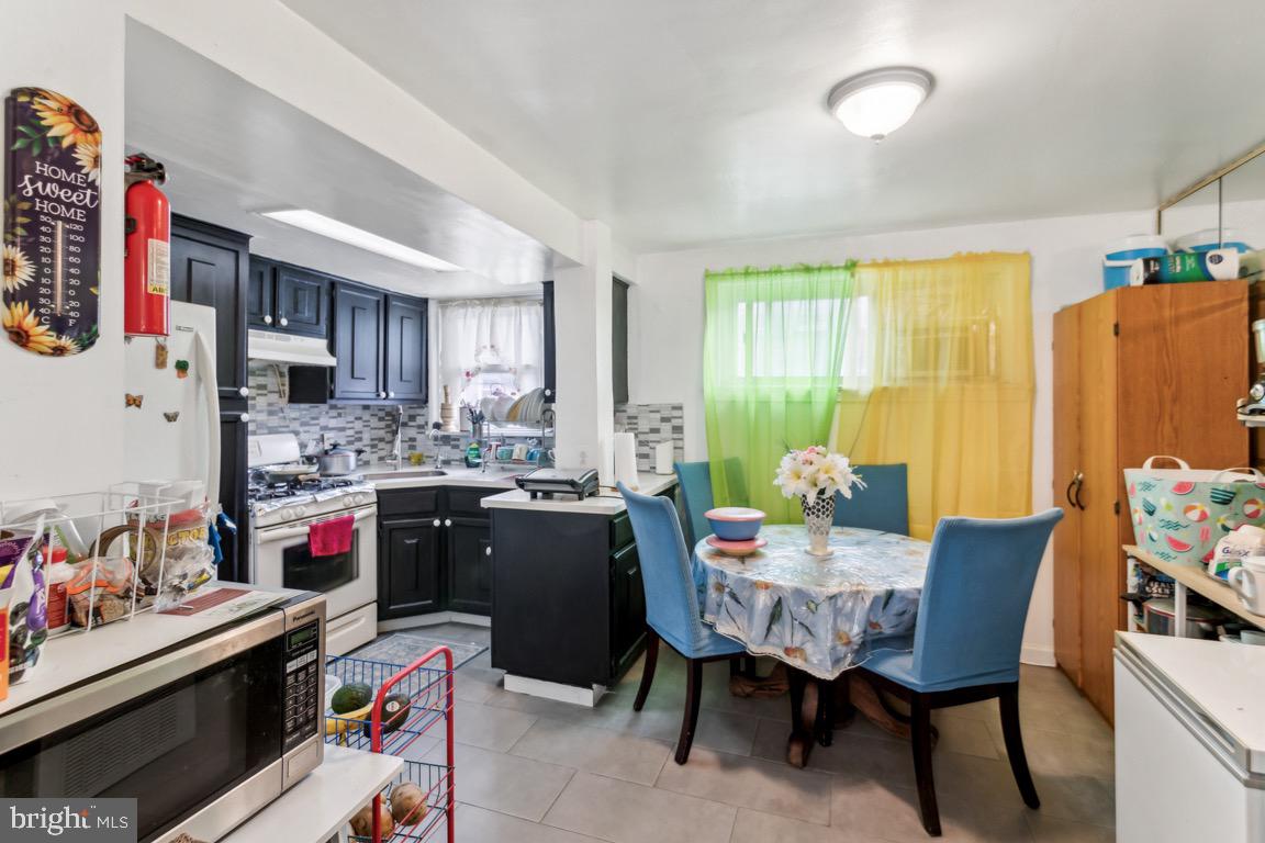 603 Raritan Street Camden, NJ 08105 - Photo 5 of 9 a view of a dining room with furniture and a window