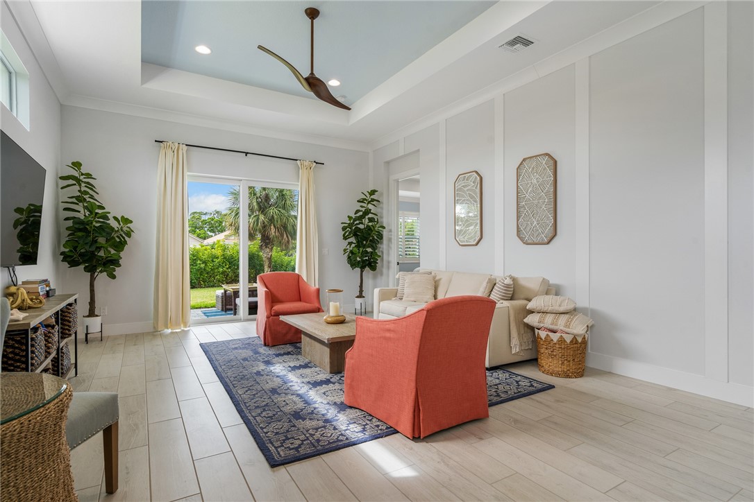 2159 Falls Manor Vero Beach, FL 32967 - Photo 17 of 36 a living room with furniture and a large window