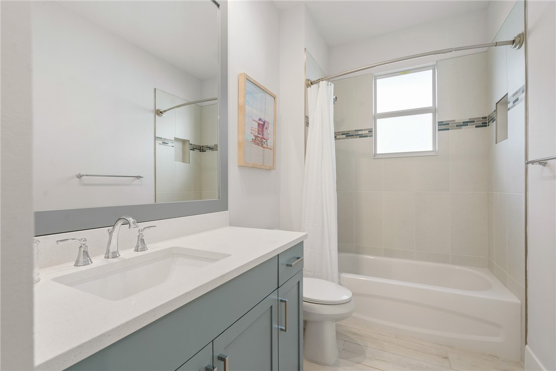 2159 Falls Manor Vero Beach, FL 32967 - Photo 25 of 36 a bathroom with a sink toilet tub and shower