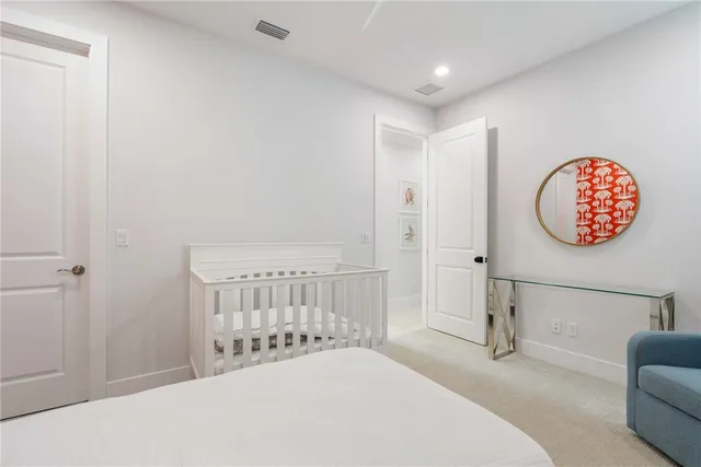 a bedroom with a bed and a chair