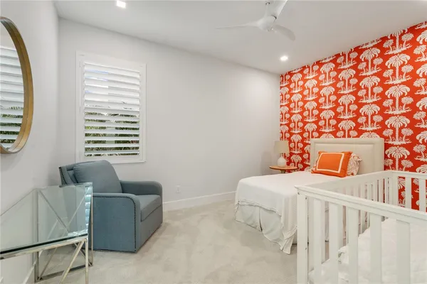 a bedroom with furniture and a window