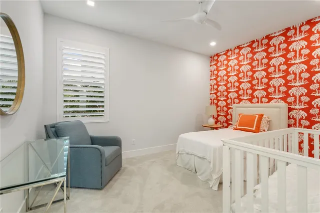 a bedroom with furniture and a window