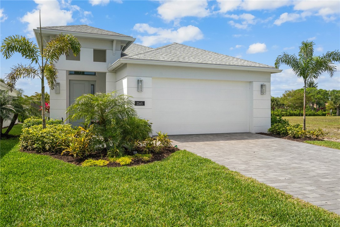 2159 Falls Manor Vero Beach, FL 32967 - Photo 36 of 36 a front view of a house with a garden