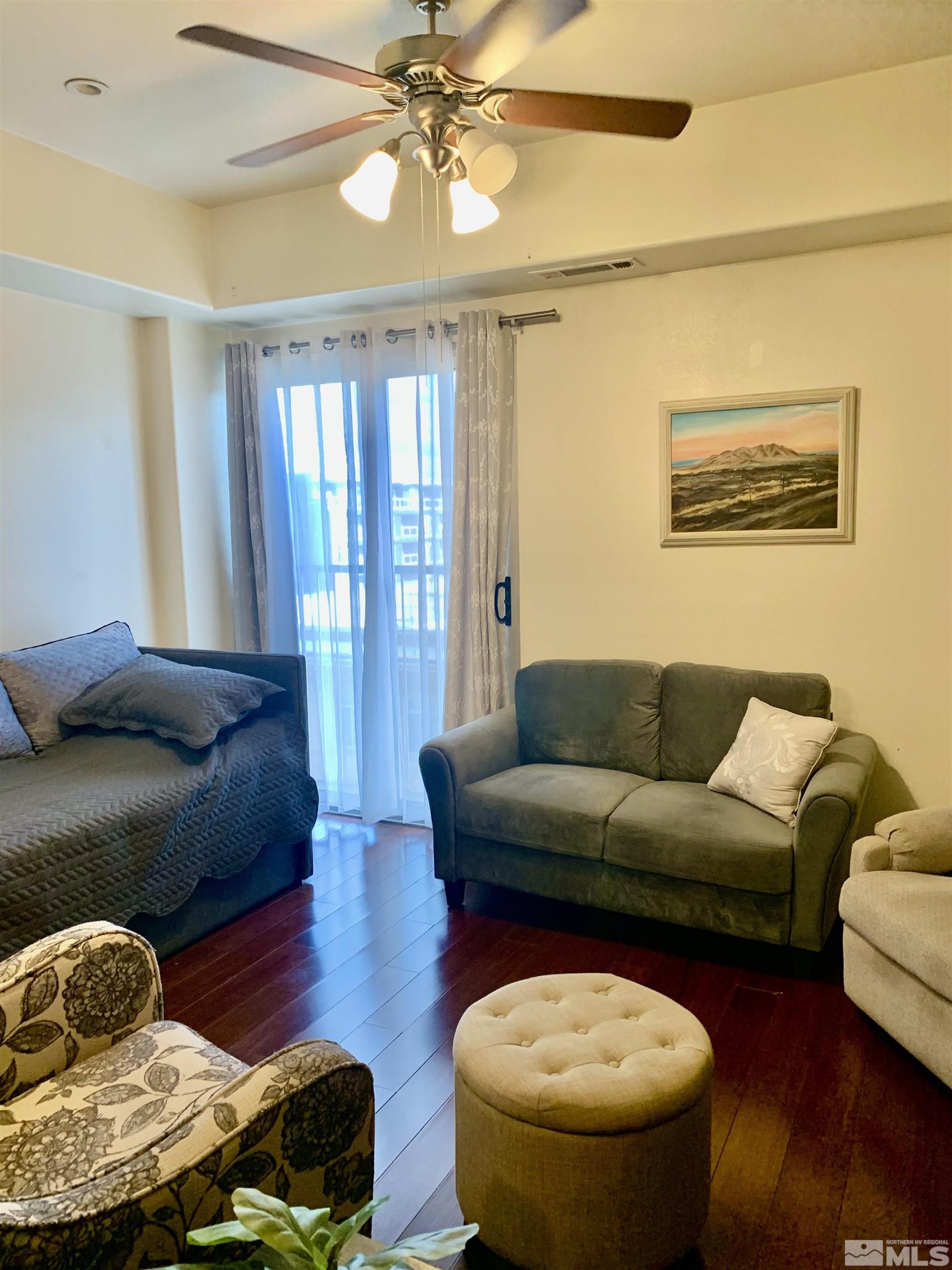 200 West 2nd Street, Unit 404 Reno, NV 89501 - Photo 8 of 30 a living room with furniture and a chandelier