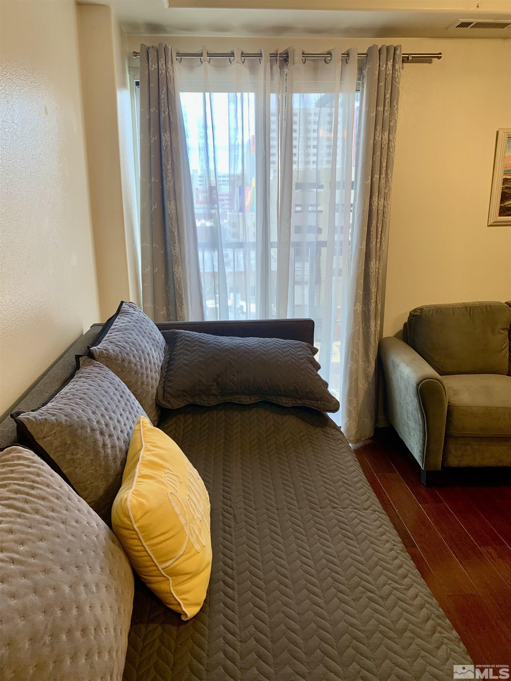 200 West 2nd Street, Unit 404 Reno, NV 89501 - Photo 9 of 30 a living room with furniture and a window