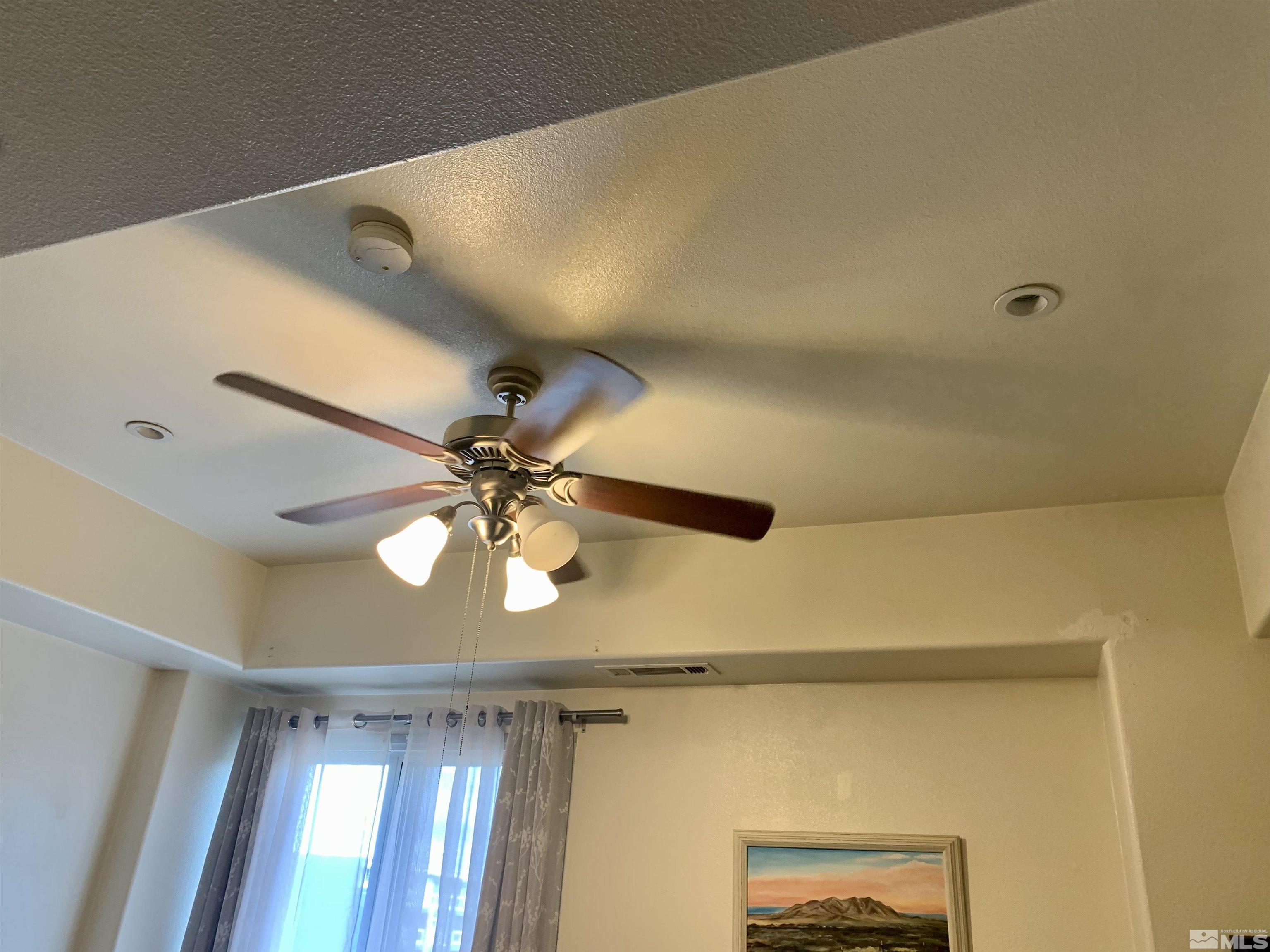 200 West 2nd Street, Unit 404 Reno, NV 89501 - Photo 10 of 30 a view of a hallway with a ceiling fan