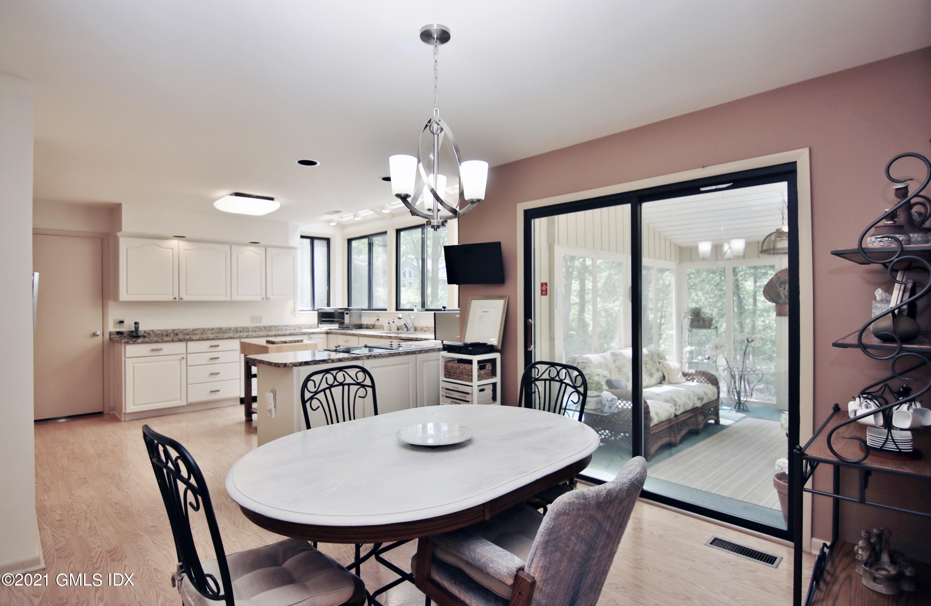 106 Gun Club Road Stamford, CT 06903 - Photo 14 of 38 a view of a dining room with furniture window and outside view