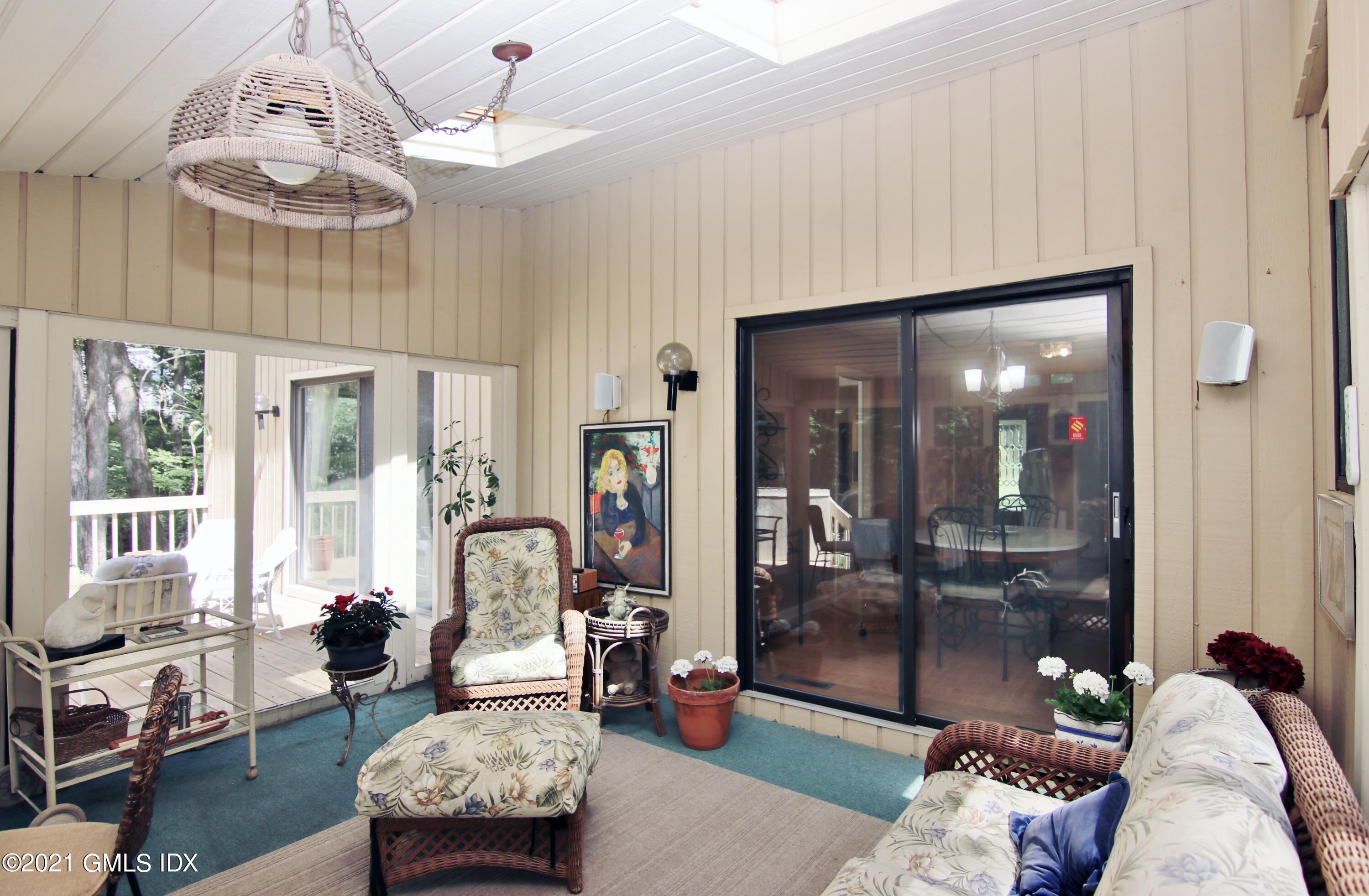 106 Gun Club Road Stamford, CT 06903 - Photo 16 of 38 a living room with furniture and a large window