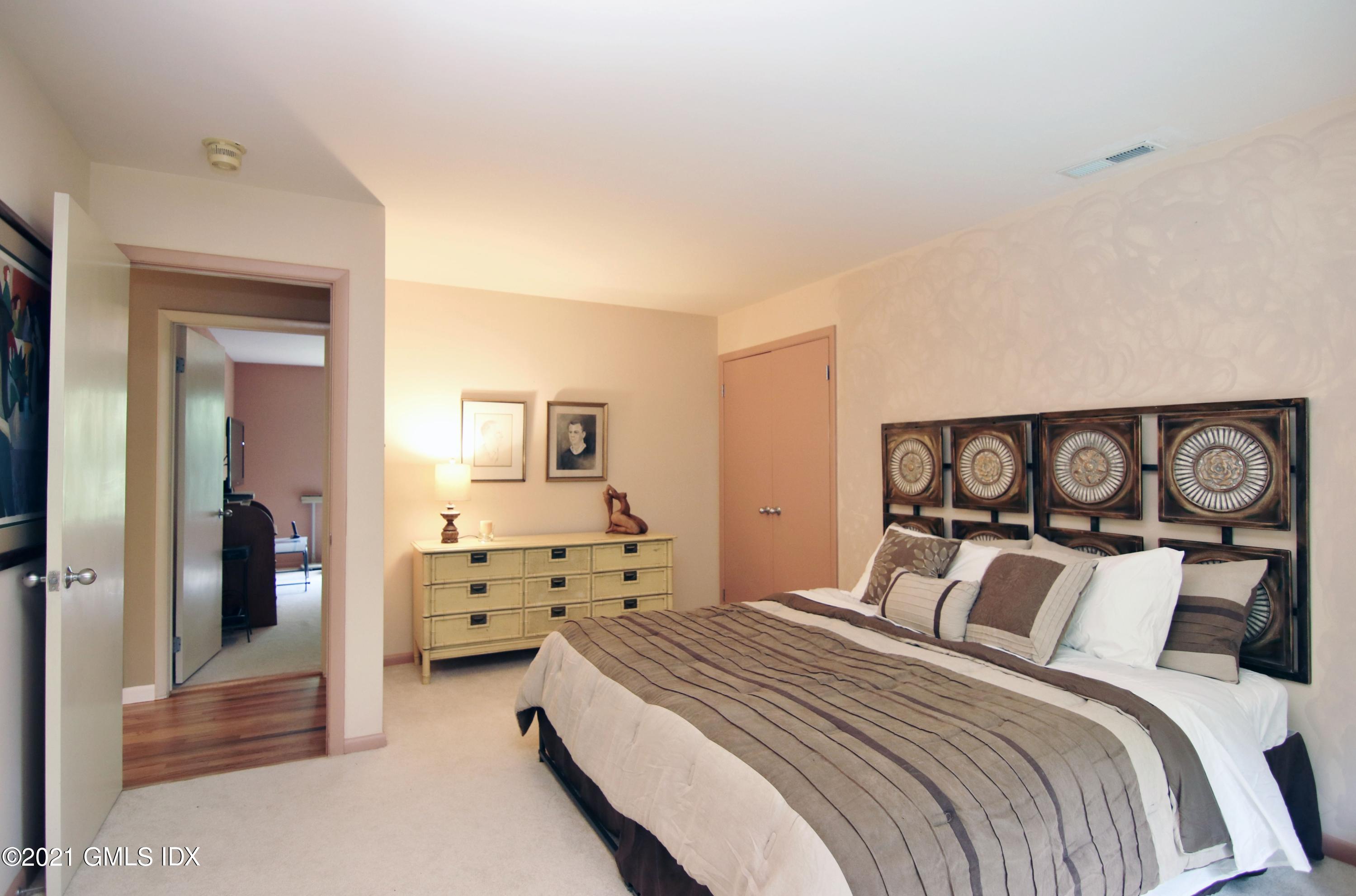 106 Gun Club Road Stamford, CT 06903 - Photo 24 of 38 a bedroom with a bed and a view of bedroom