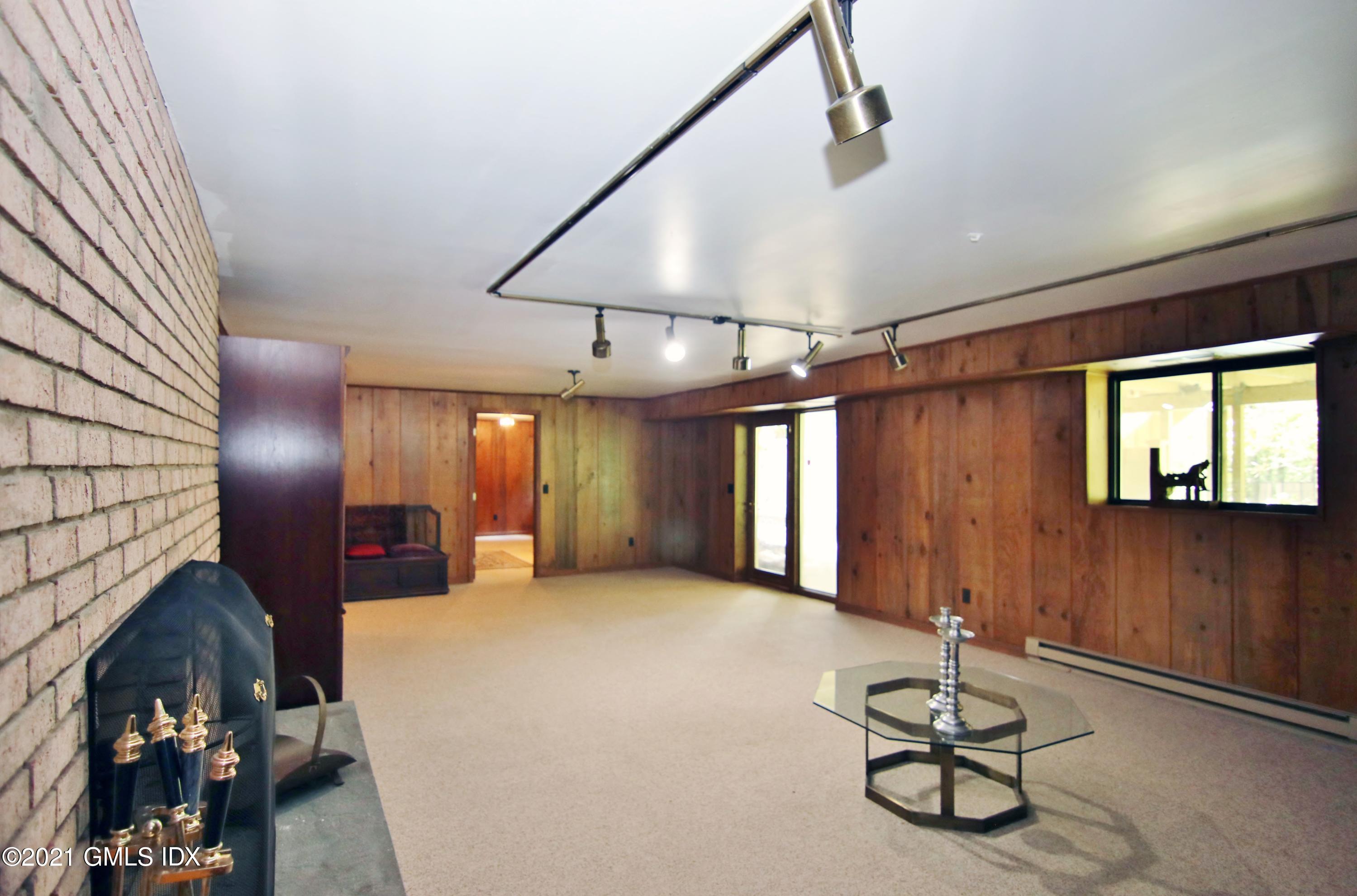 106 Gun Club Road Stamford, CT 06903 - Photo 30 of 38 a view of a livingroom with furniture and window