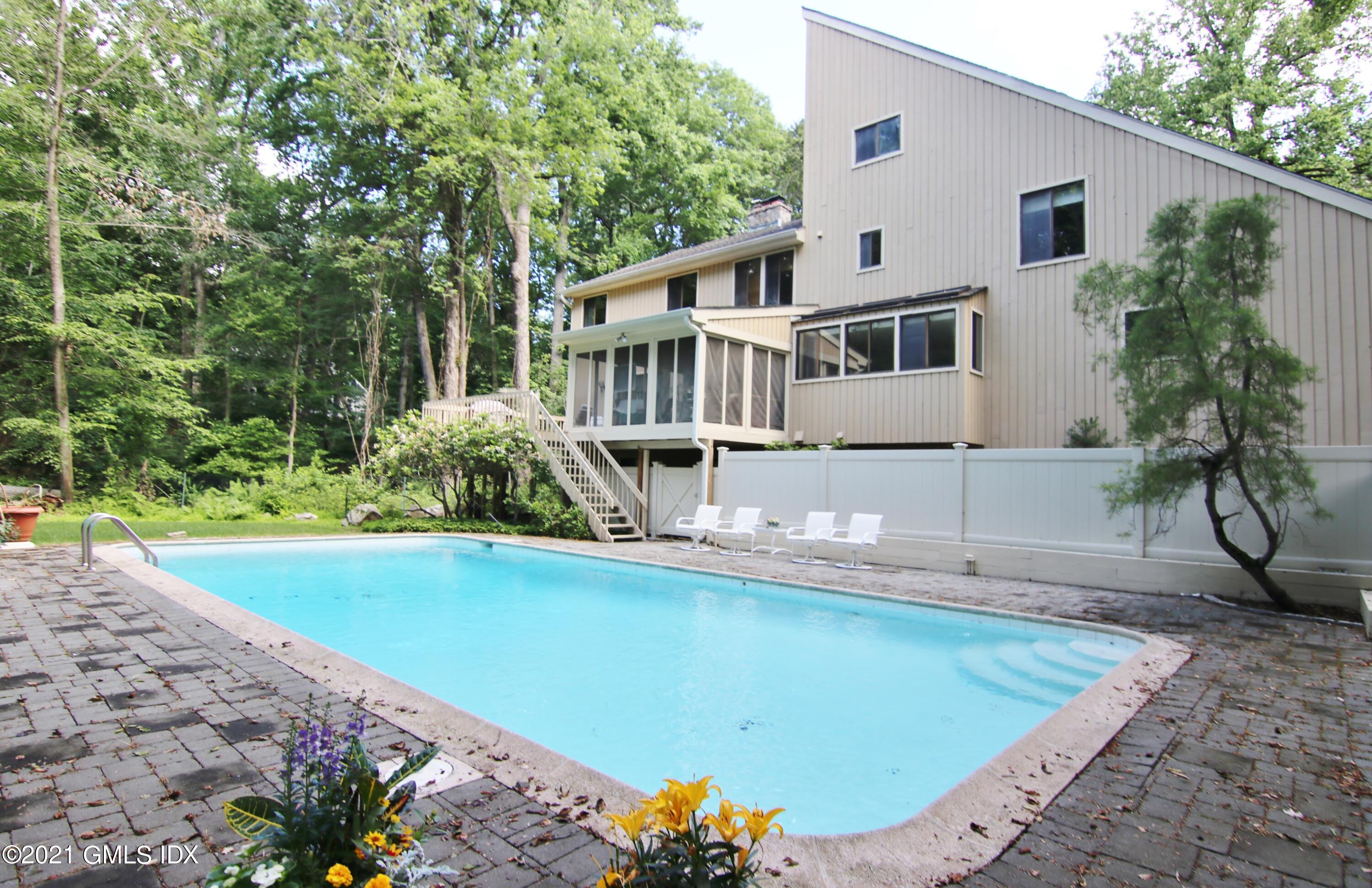 106 Gun Club Road Stamford, CT 06903 - Photo 3 of 38 a view of a house with pool and sitting area
