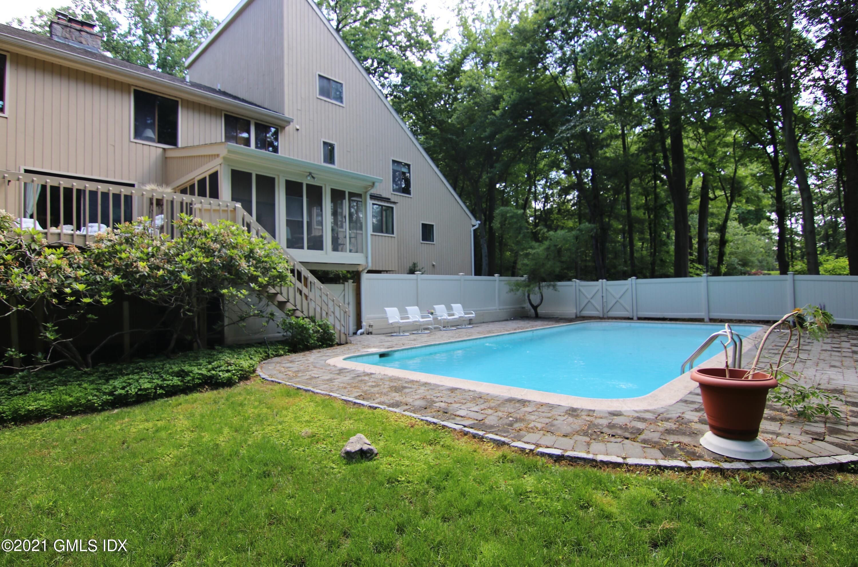 106 Gun Club Road Stamford, CT 06903 - Photo 37 of 38 a view of a house with a yard and sitting area