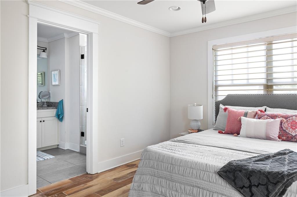 1333 Oakview Road Decatur, GA 30030 - Photo 14 of 28 a bedroom with a bed and wooden floor