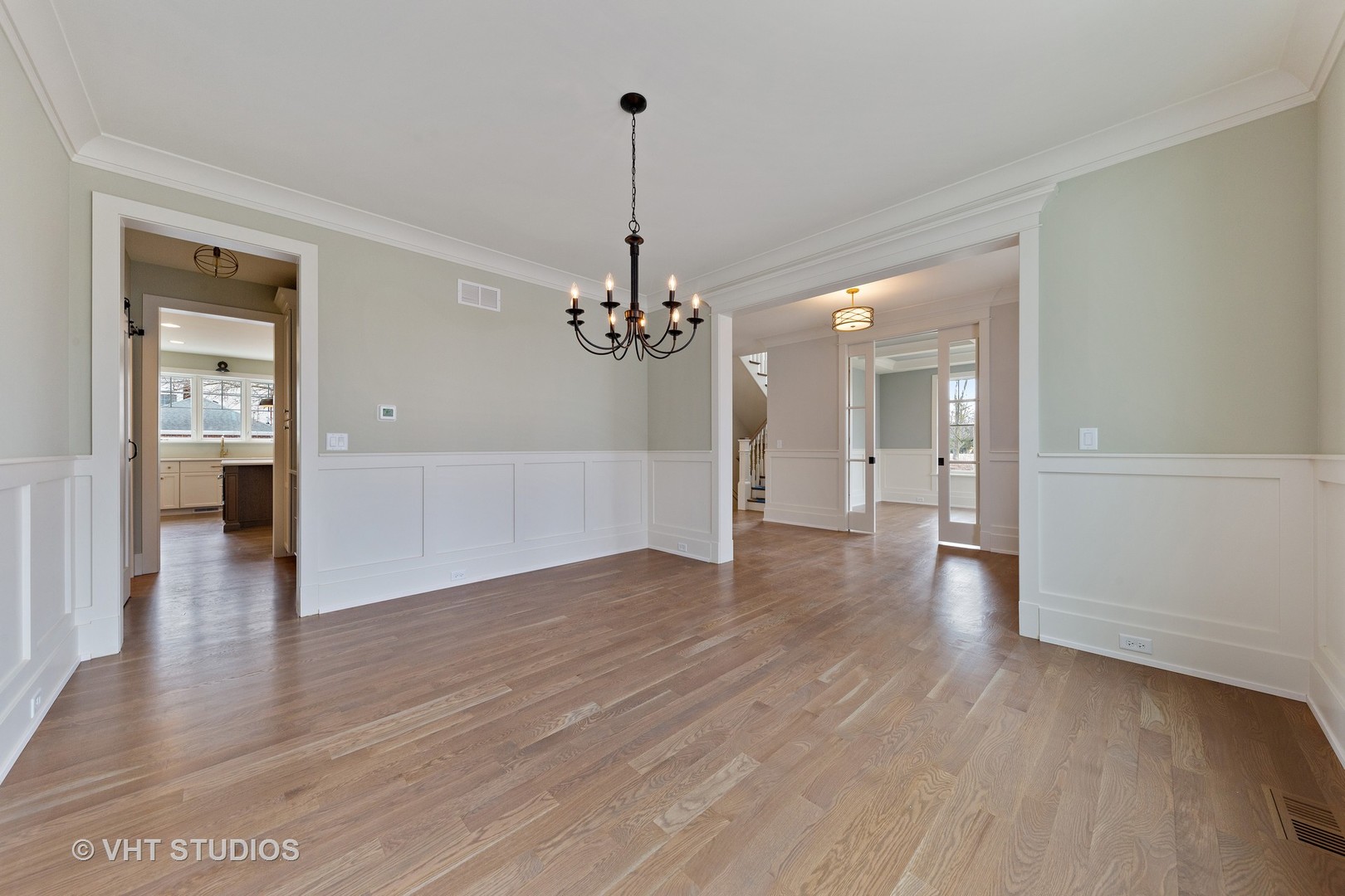 469 South Sunnyside Avenue Elmhurst, IL 60126 - Photo 11 of 37 a view of a room with wooden floor and a kitchen