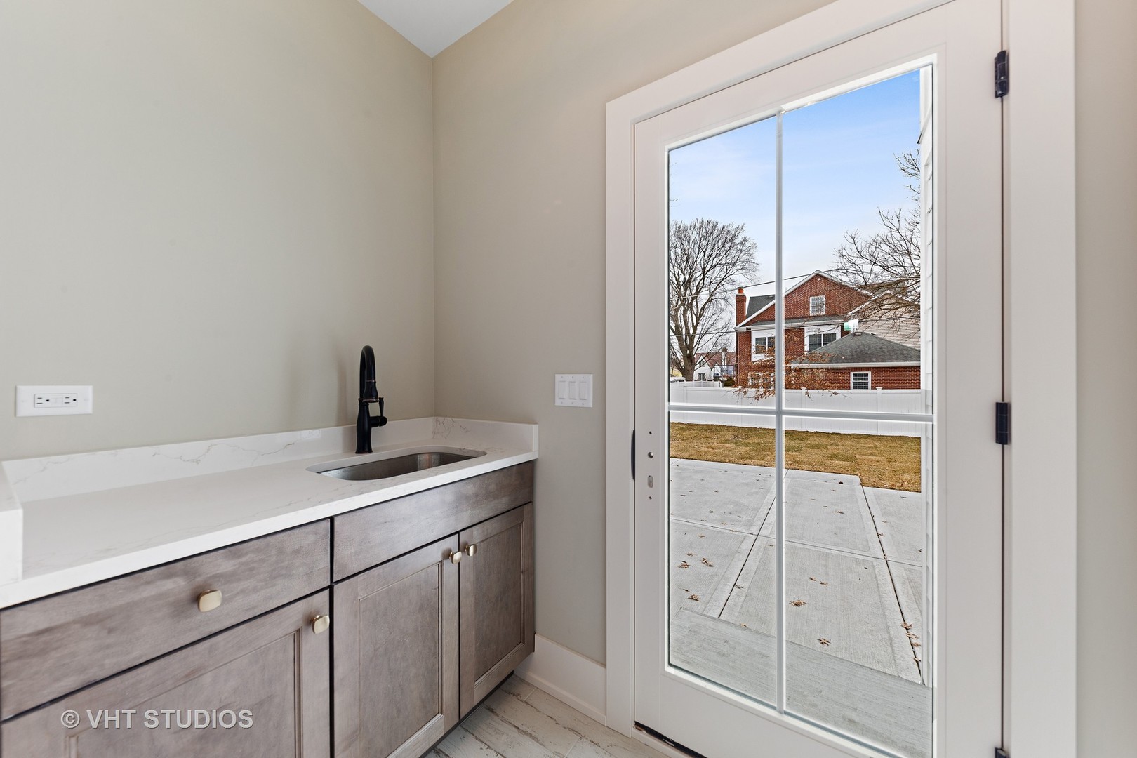 469 South Sunnyside Avenue Elmhurst, IL 60126 - Photo 16 of 37 a kitchen with a granite countertop sink and cabinets