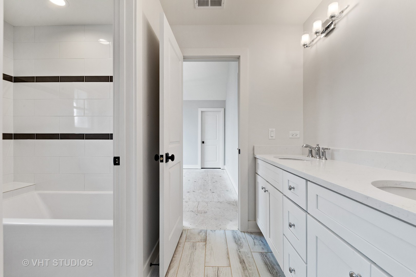 469 South Sunnyside Avenue Elmhurst, IL 60126 - Photo 26 of 37 a bathroom with a sink a mirror and a shower