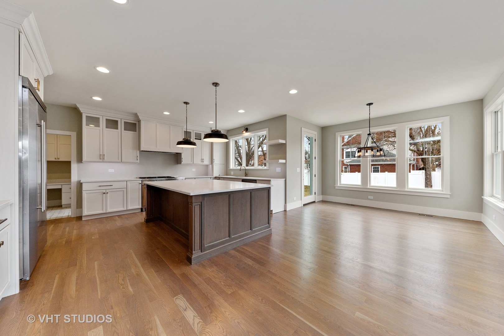 469 South Sunnyside Avenue Elmhurst, IL 60126 - Photo 5 of 37 a large kitchen with stainless steel appliances granite countertop a large counter top and a wooden floors