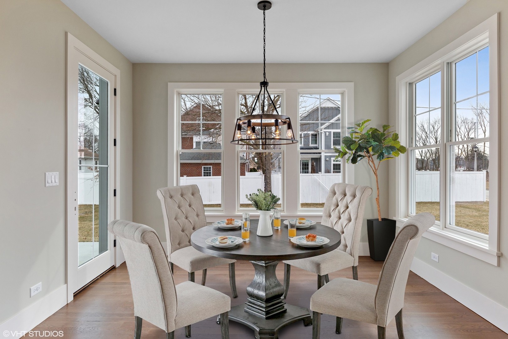 469 South Sunnyside Avenue Elmhurst, IL 60126 - Photo 8 of 37 a view of a dining room with furniture window and wooden floor