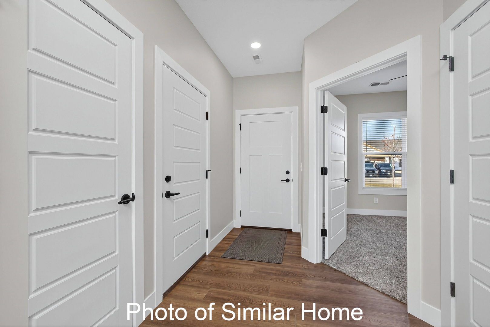 446 North 2nd Street Eldridge, IA 52748 - Photo 2 of 28 a view of a hallway with wooden floor and closet