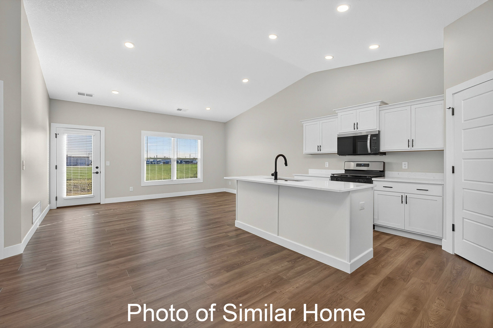 446 North 2nd Street Eldridge, IA 52748 - Photo 9 of 28 a view of kitchen with sink stainless steel appliances and window
