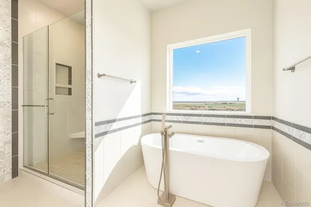 a bathroom with a bathtub and a shower