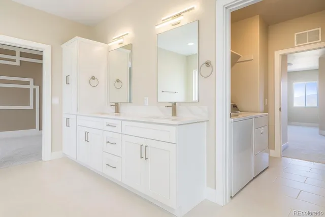 a bathroom with a granite countertop sink mirror and a