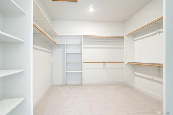 a view of an empty walk in closet