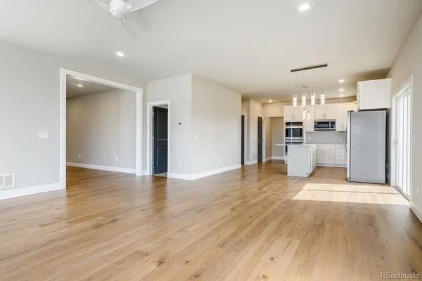 a view of a kitchen with wooden floor