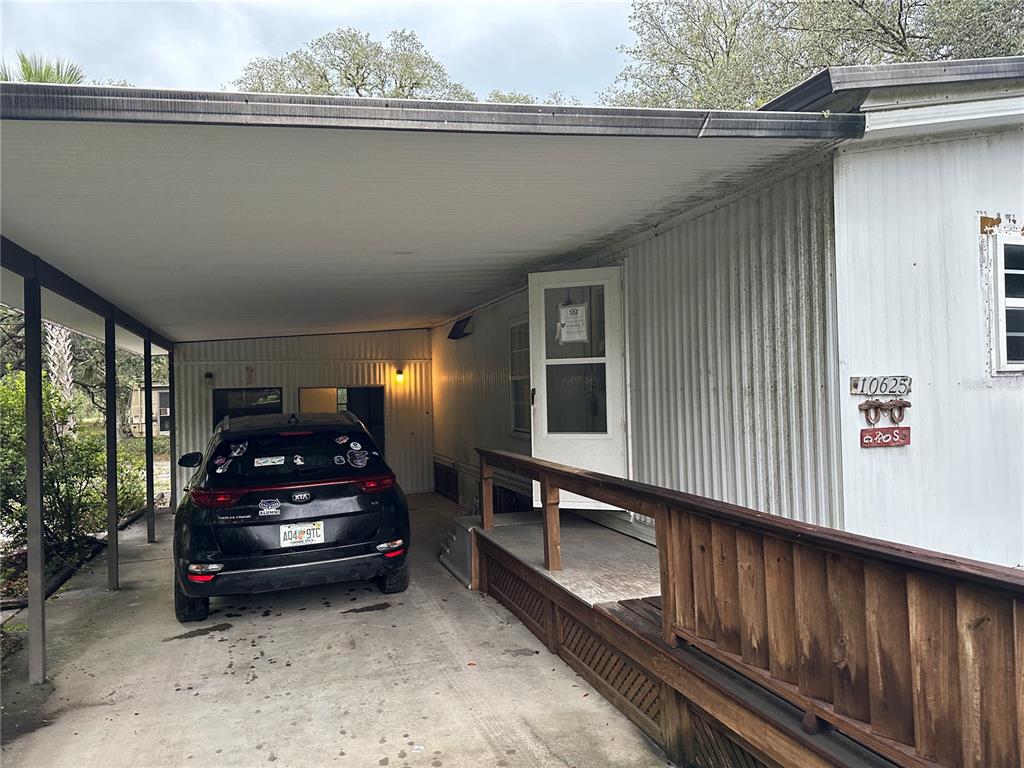 10625 Northeast 153 Street Fort McCoy, FL 32134 - Photo 6 of 7 a car parked in a parking garage