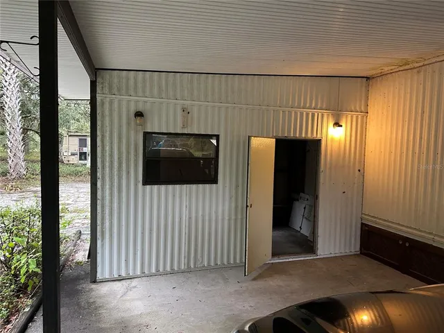 a view of a livingroom and a hallway