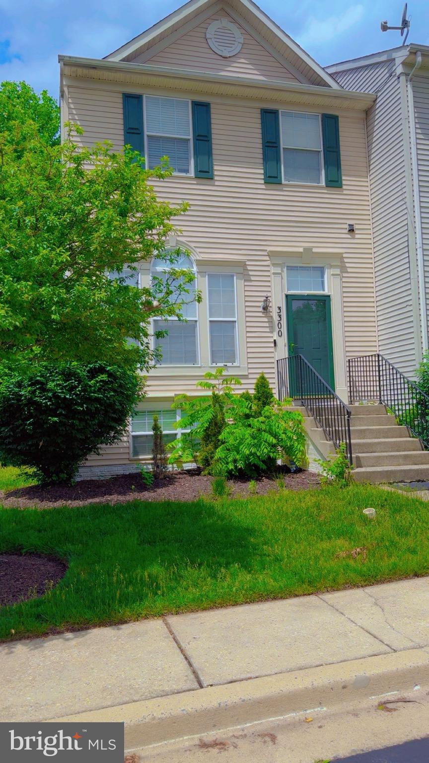 3300 Yellow Flower Road Laurel, MD 20724 - Photo 2 of 20 a front view of a house with a yard and garage