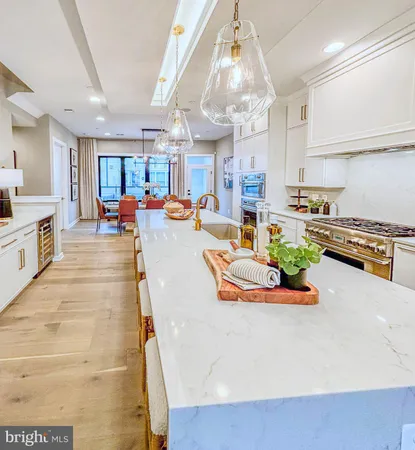 a large kitchen with a table and chairs in it